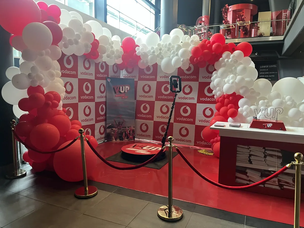 Selfie 360 platform at a Vodacom activation surrounded by red and white balloons