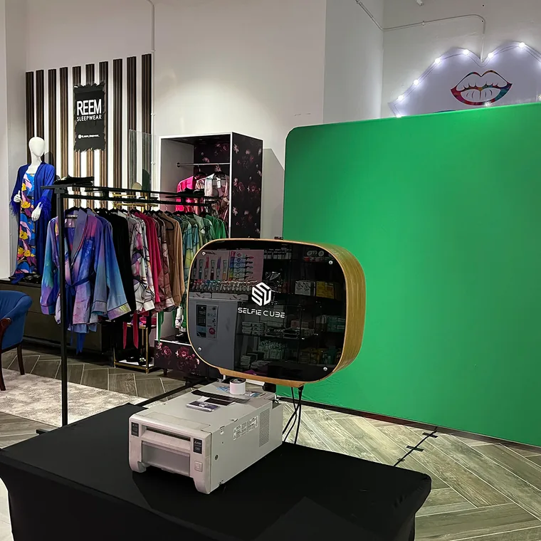 Selfie Cube camera positioned in front of a green screen