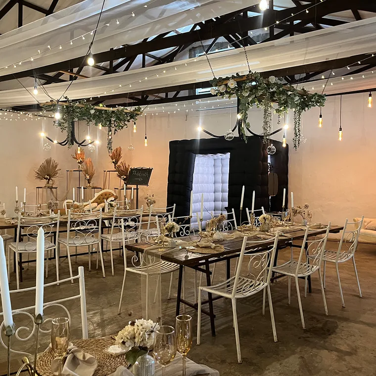 Black inflatable photo booth prepared inside a wedding venue
